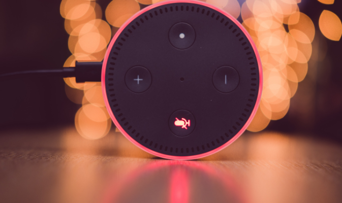 a Amazon Alexa with a red light